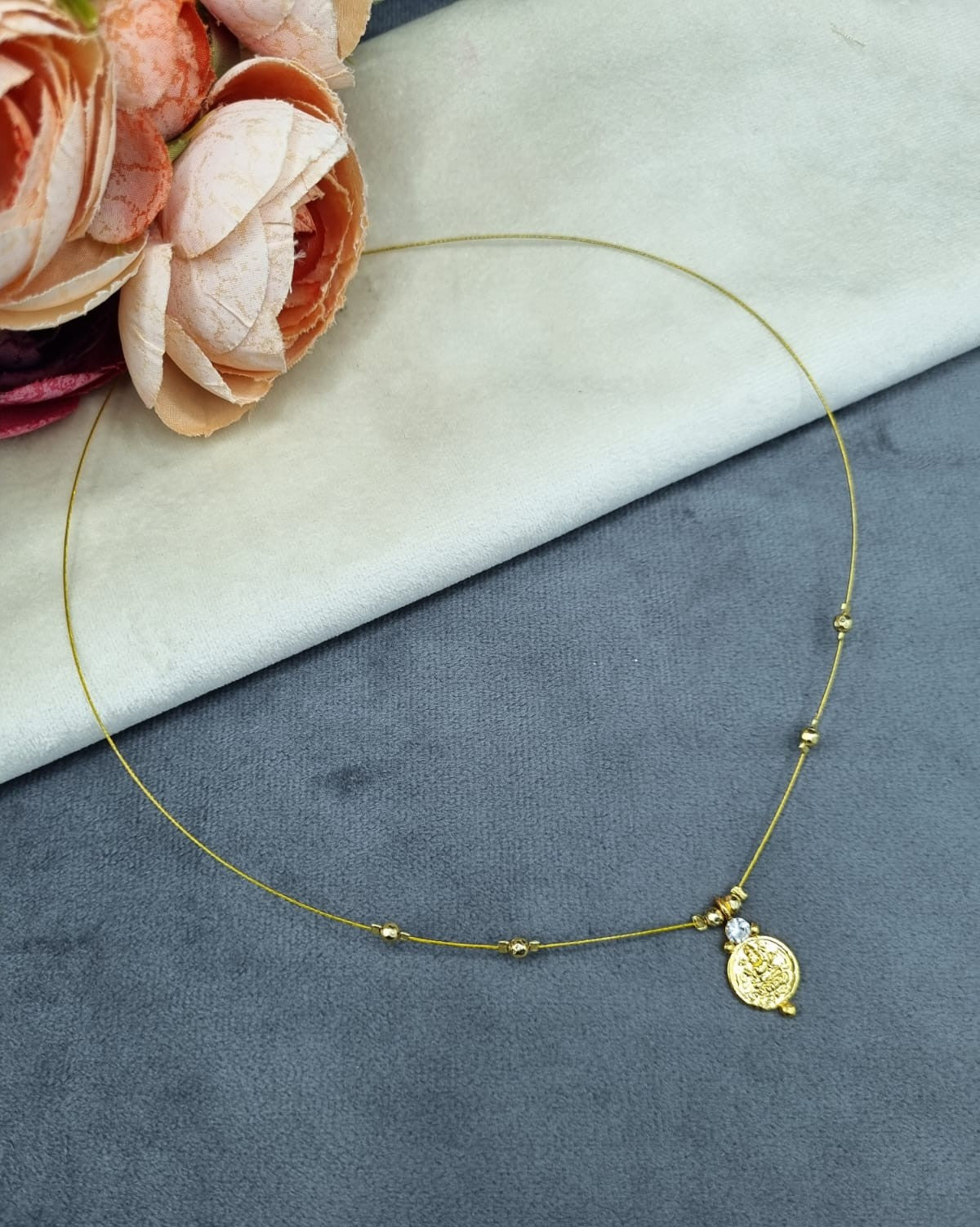 Invisible Wire Lakshmi Coin Pendant Necklace with Gold Bead Accents