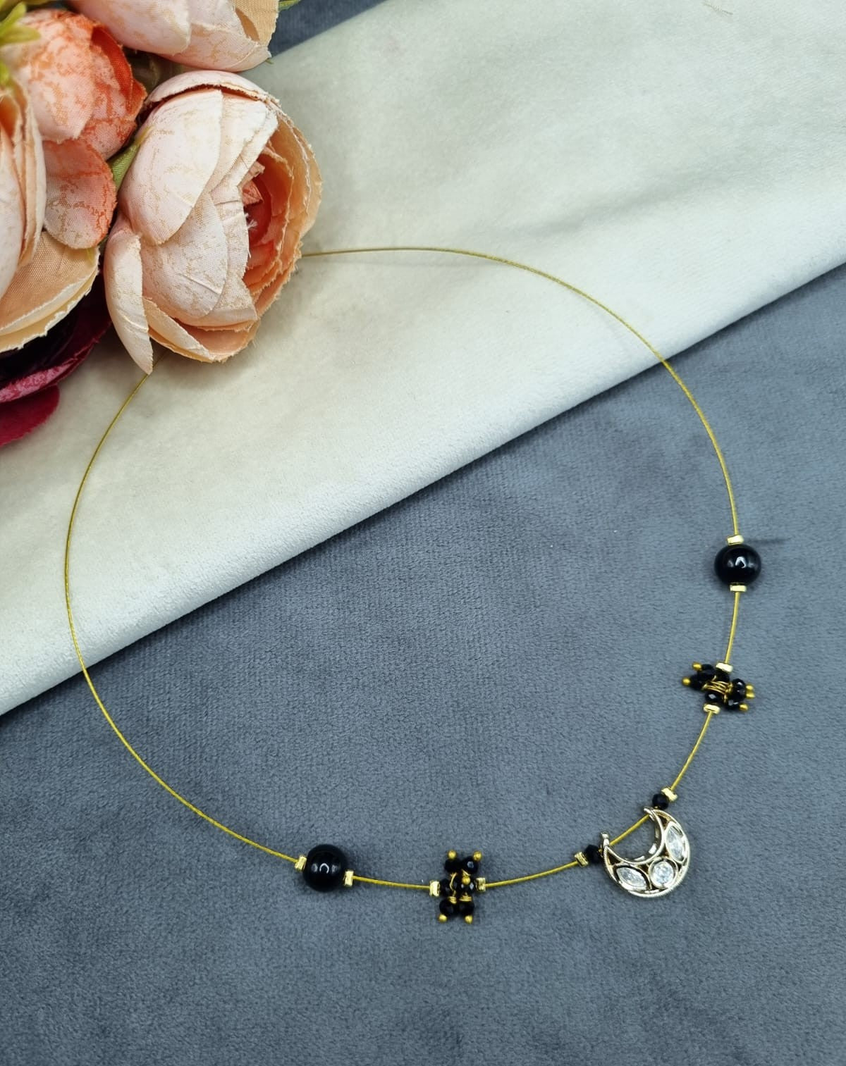 Invisible Wire Crescent Pendant Necklace with Black Bead Accents